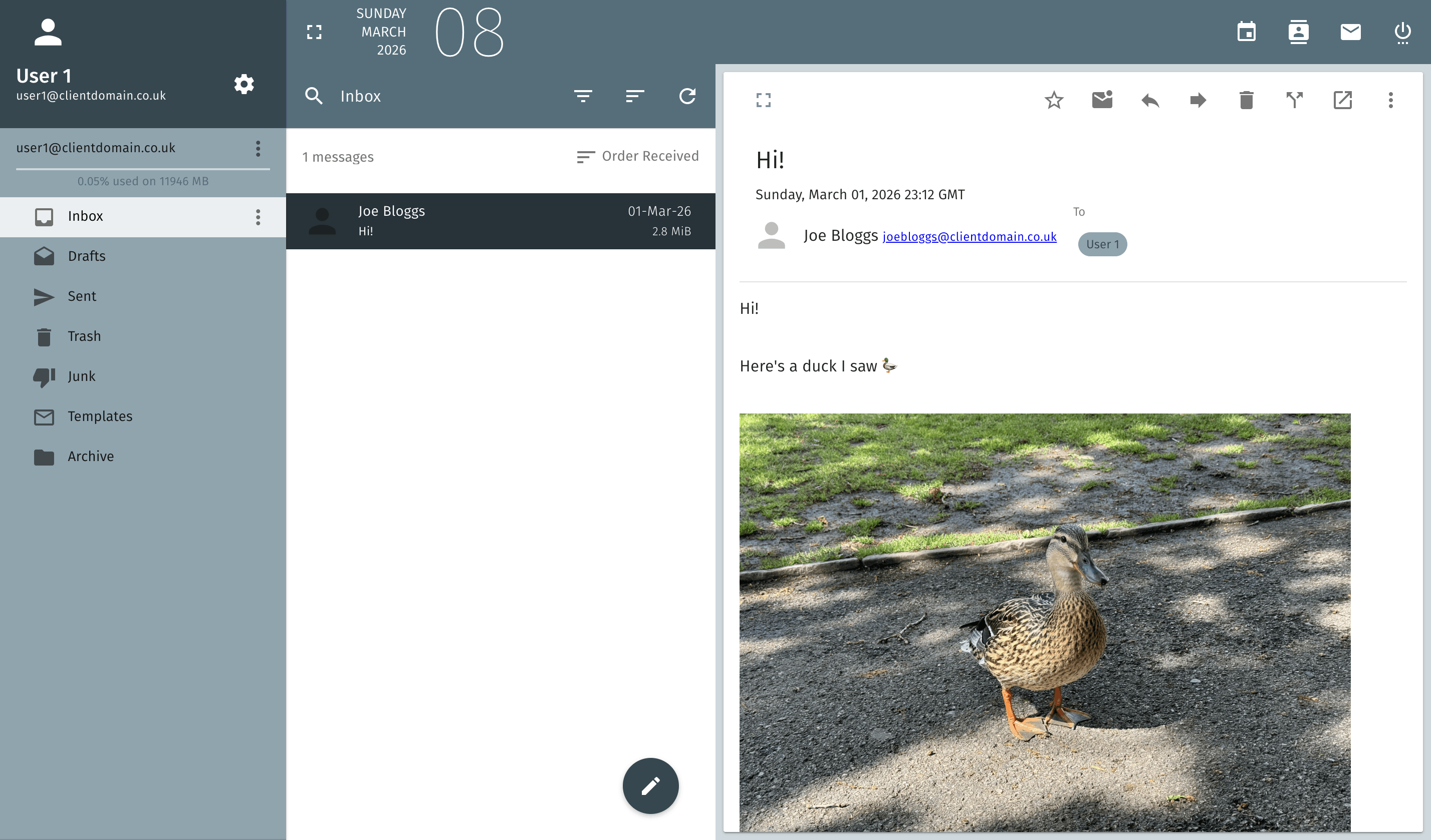 Webmail client showing an inbox with an open email containing a photo, and a folder sidebar on the left